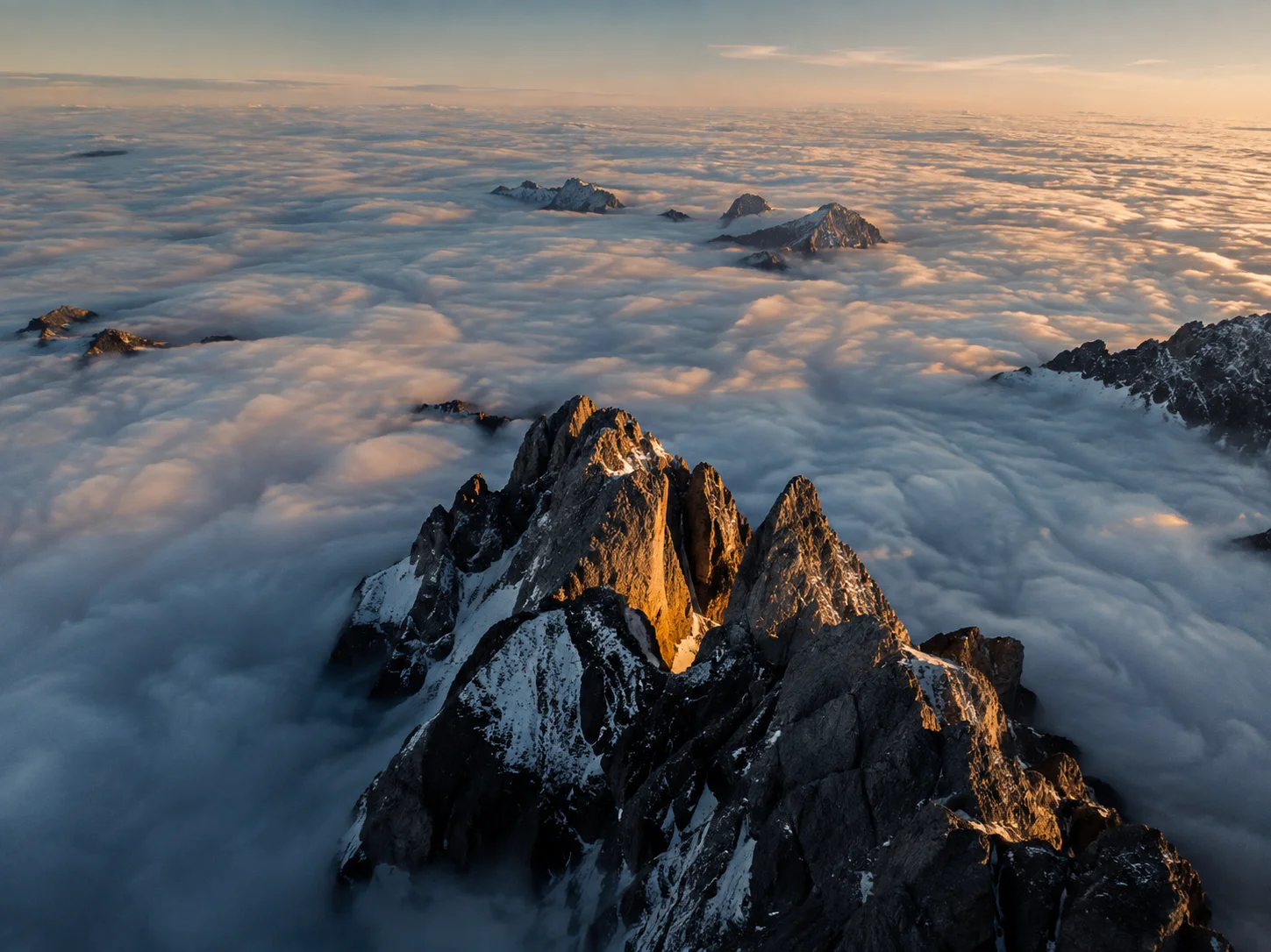 Mountain Peaks Rising Above a Sea of Clouds wallpaper full preview